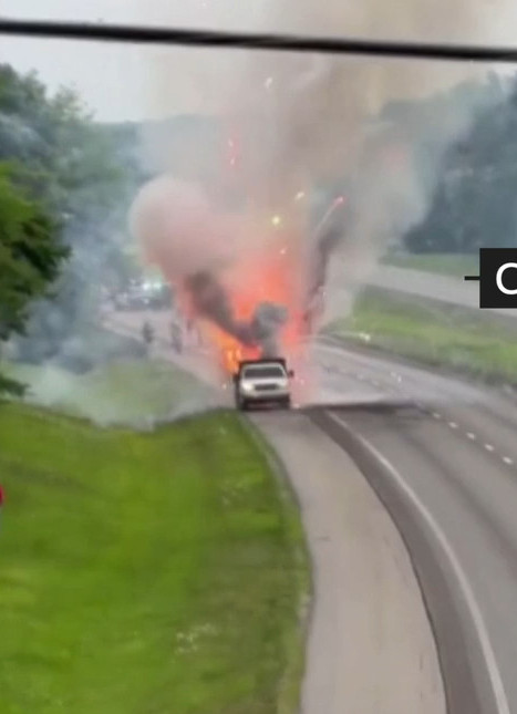 [IMG: the lorry in pyro mode in traffic, captured from a bridge above