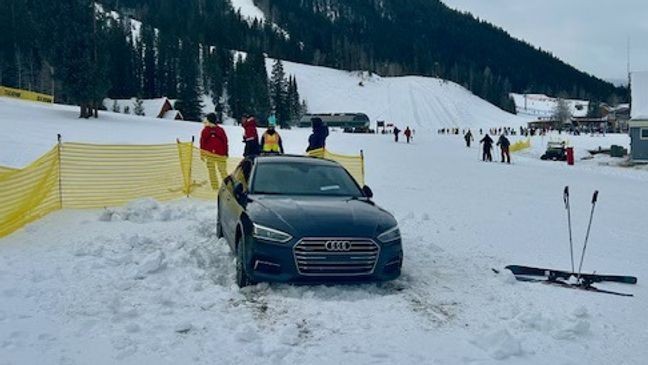 {IMG: The car, on the slopes but not wearing skis