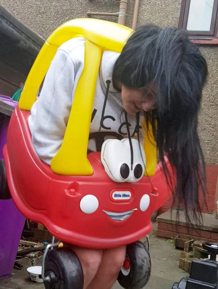 [IMG:
Archibald squeezed into the Little Tikes car]