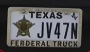 [IMG: License-plate frame proclaiming this a ferderal track]