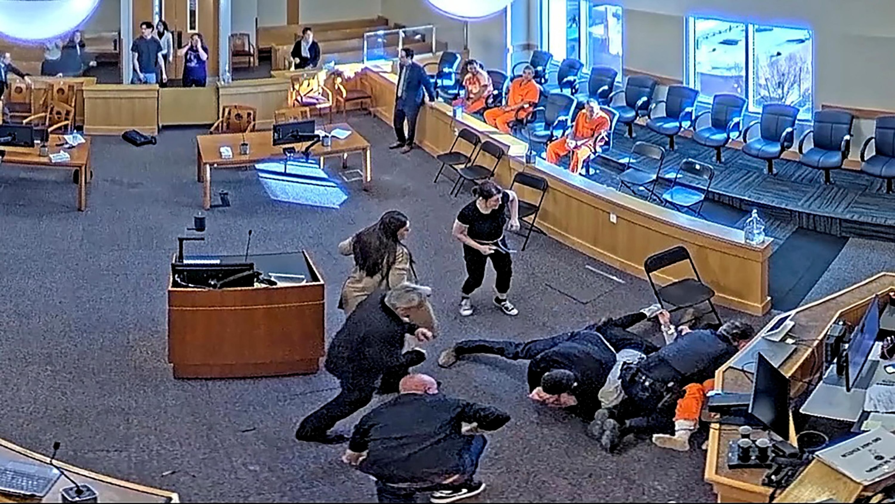 {IMG: Fisticuffery on display in a still from courtroom footage