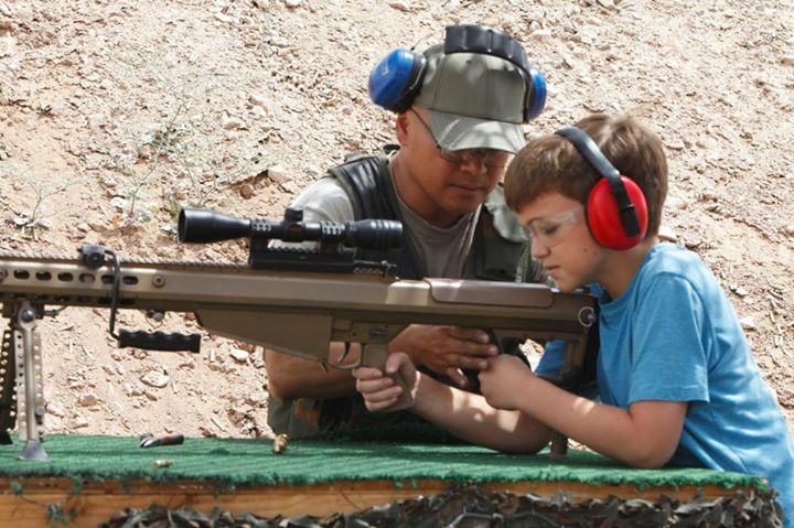 [IMG: Little kid with big firearm]