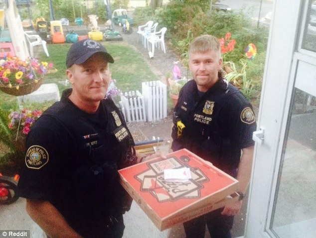 [IMG: Cops pose after delivering pizza]