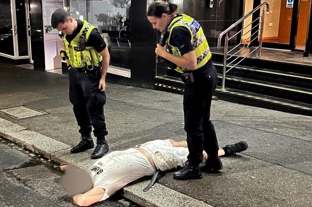 [IMG: Our hero lying outside the hotel]