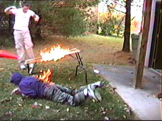 [IMG: Backyard wrestling, flaming card table style]